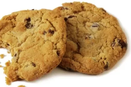 two-chocolate-chip-cookies-one-with-bite-out-of-it