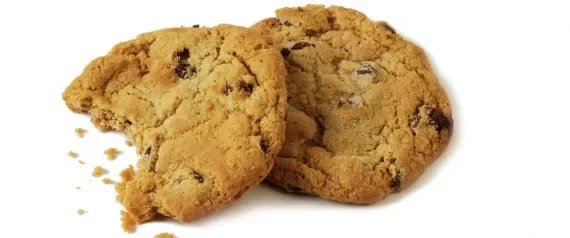 two-chocolate-chip-cookies-one-with-bite-out-of-it